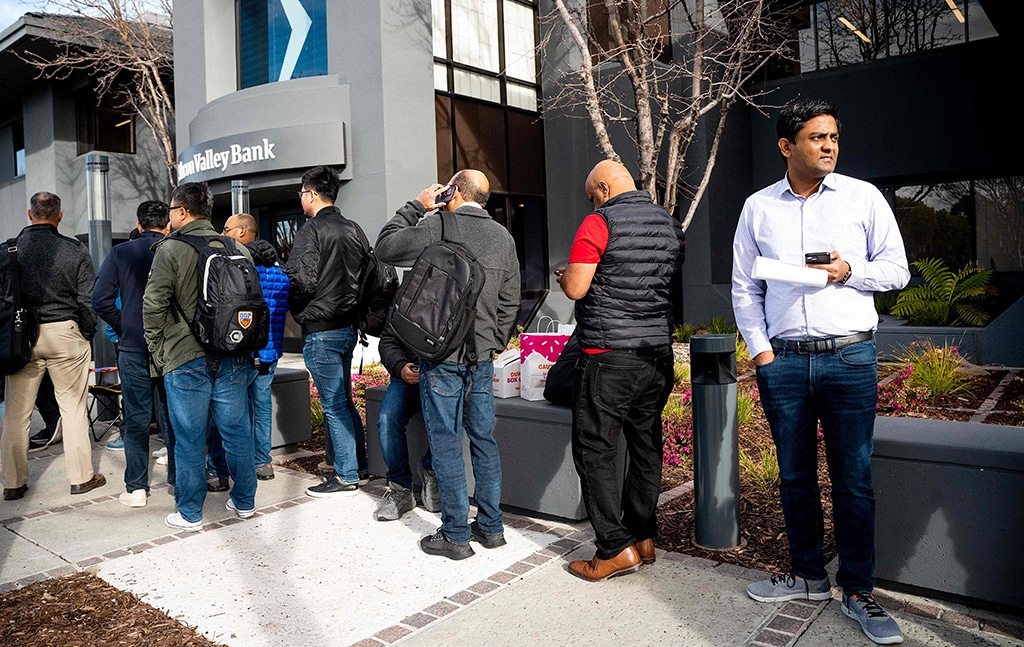 SANTA CLARA: Silicon Valley Bank customers wait in line at SVB’s headquarters on March 13, 2023. – AFP