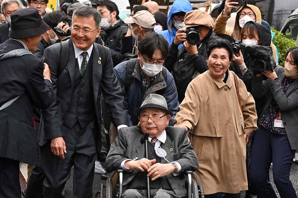 TOKYO: Hideko Hakamada (front-R) and supporters of her brother Iwao Hakamada, enter the Tokyo High Court on March 13, 2023. - AFP