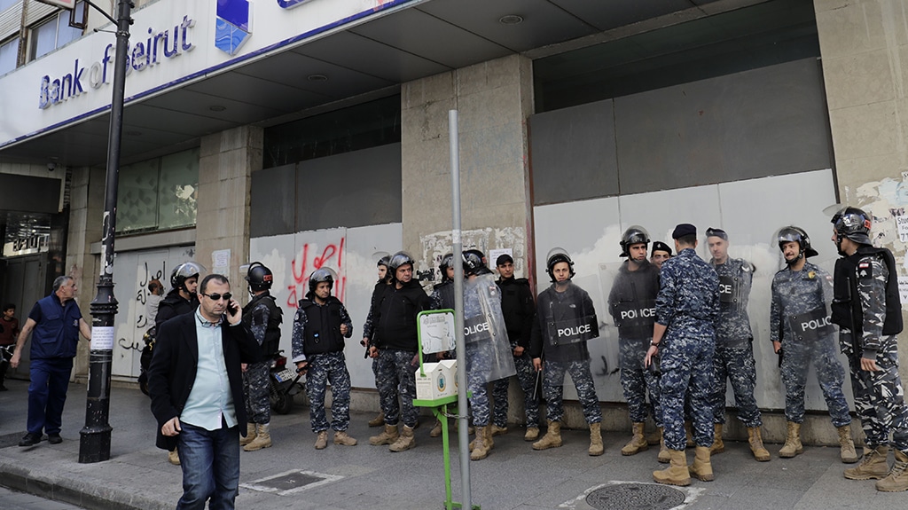 BEIRUT: Lebanese forces secure a private bank in Beirut during a demonstration by members of the banks depositors committee against monetary policies. – AFP