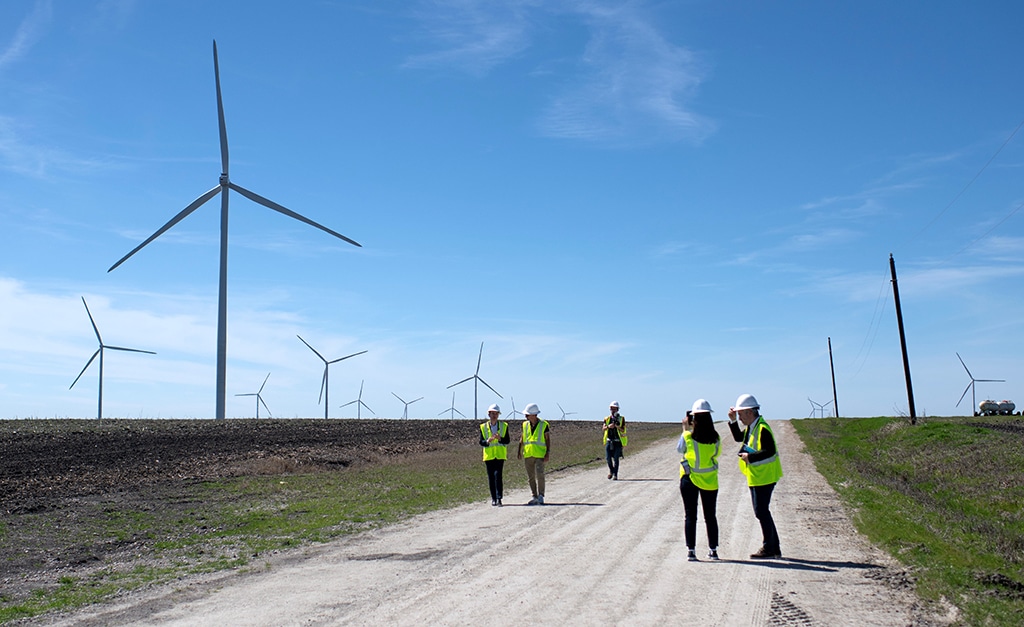DAWSON, United States: In this file photo taken on February 28, 2023, Engie employees inspect wind turbines during a tour for the dedication of the Limestone Wind Project in Dawson, Texas. - AFP