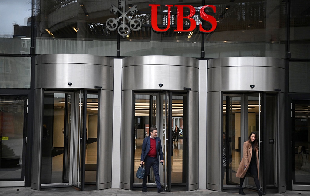 LONDON: People use the entrance of the London office of Swiss bank UBS in central London, on March 20, 2023. - AFP