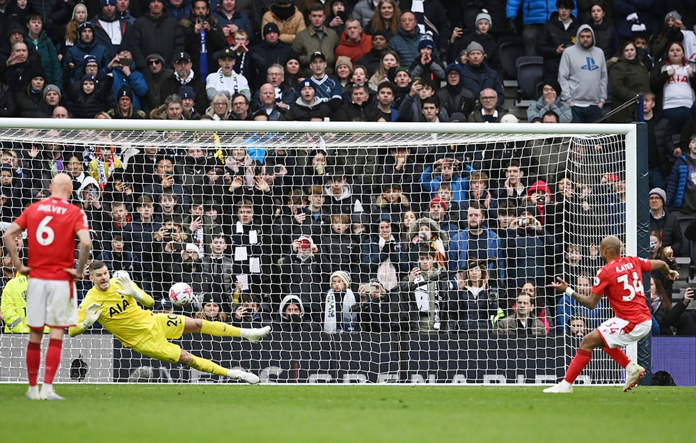 LONDON: Tottenham Hotspur’s English goalkeeper Fraser Forster (2L) saves a penalty shot by Nottingham Forest’s Ghanean midfielder Andre Ayew during the English Premier League football match between Tottenham Hotspur and Nottingham Forest at Tottenham Hotspur Stadium in London. — AFP