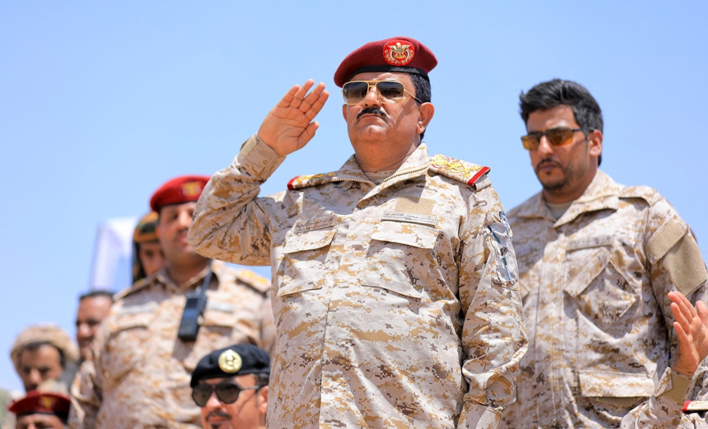 MARIB: Yemeni Defence Minister Lieutenant General Mohsen Mohammed Al-Daeri (C) attends a military parade of fighters loyal to the Saudi-backed government during a graduation ceremony of officers and the completion of specialised military courses. – AFP