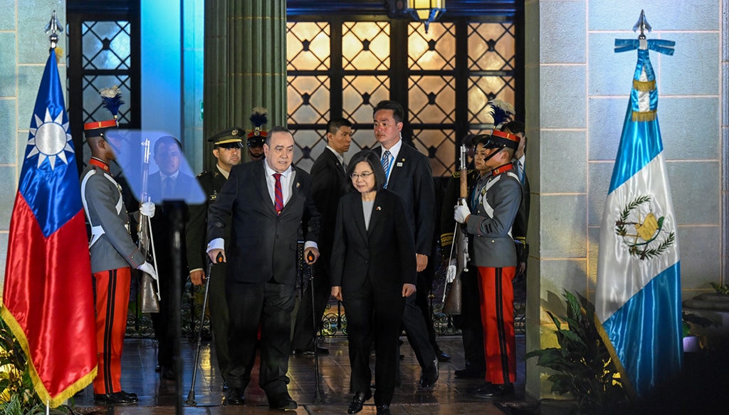 GUATEMALA CITY: Taiwan's President Tsai Ing-wen (L) and Guatemala's President Alejandro Giammattei arrive to deliver a joint statement at the Culture Palace in Guatemala City on March 31, 2023.—AFP