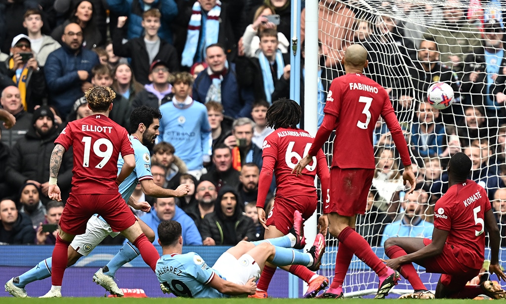 MANCHESTER: Manchester City’s German midfielder Ilkay Gundogan (2nd left) turns to celebrate after scoring their third goal during the English Premier League football match between Manchester City and Liverpool on April 1, 2023. – AFP