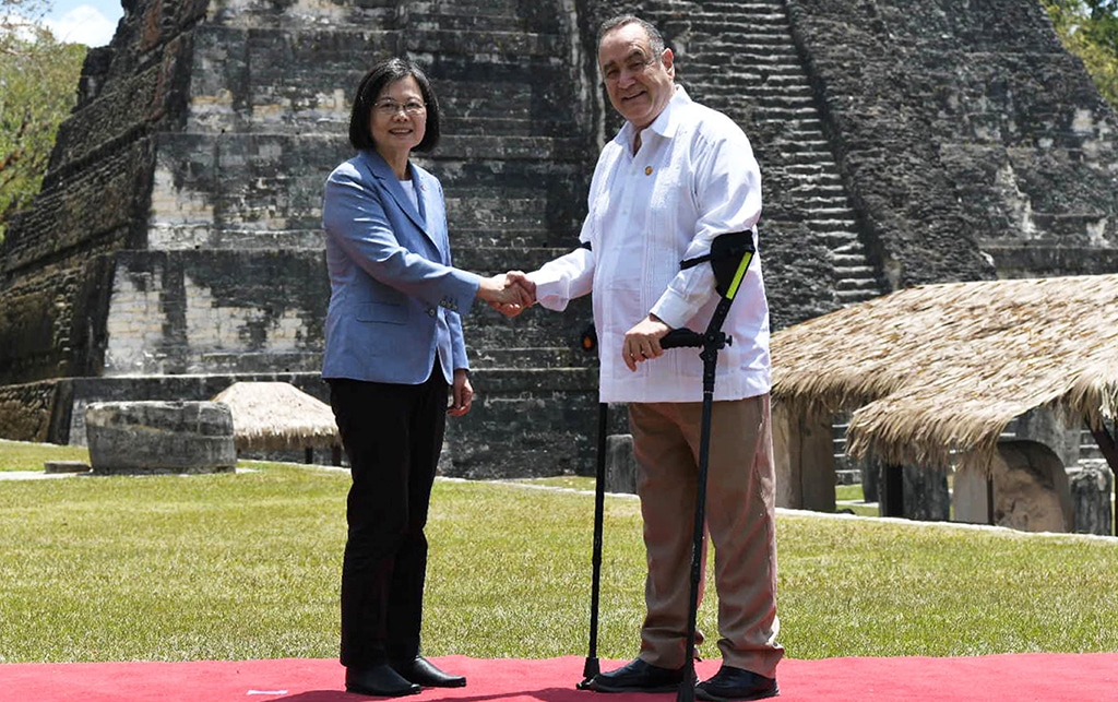 TIKAL: handout picture shows Taiwan's President Tsai Ing-wen (L) and Guatemala's President Alejandro Giammattei (R) shaking hands at the Tikal archaeological site in Peten, Guatemala. – AFP