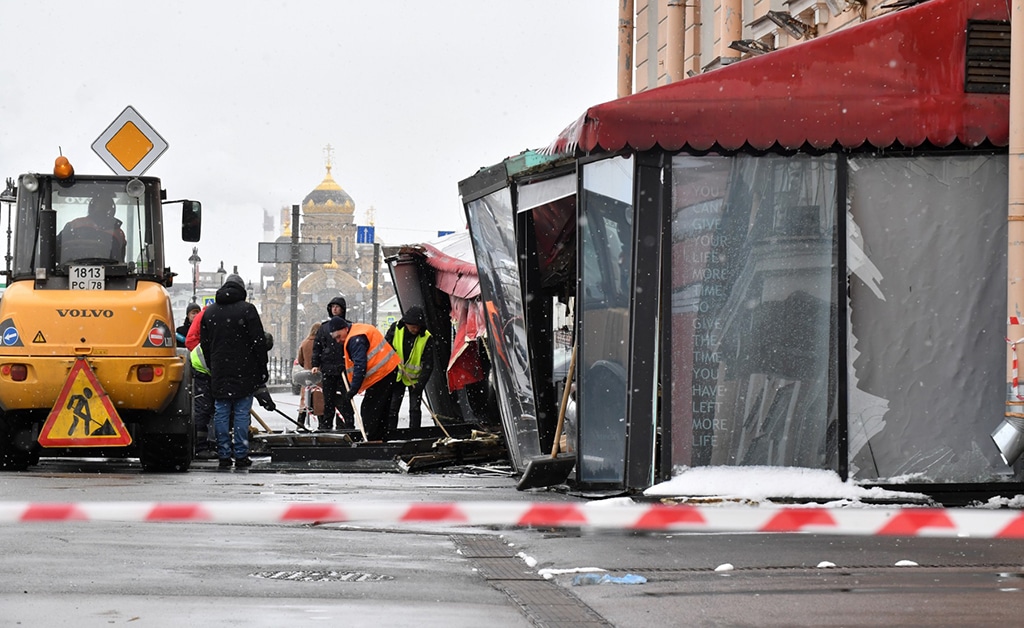 SAINT PETERSBURG: Municipal workers clean the debris in the aftermath of the April 2 bomb blast in a cafe in Saint Petersburg on April 3, 2023. Sunday’s explosion in a Saint Petersburg cafe wounded dozens and killednRussia’s top military blogger Vladlen Tatarsky. — AFP