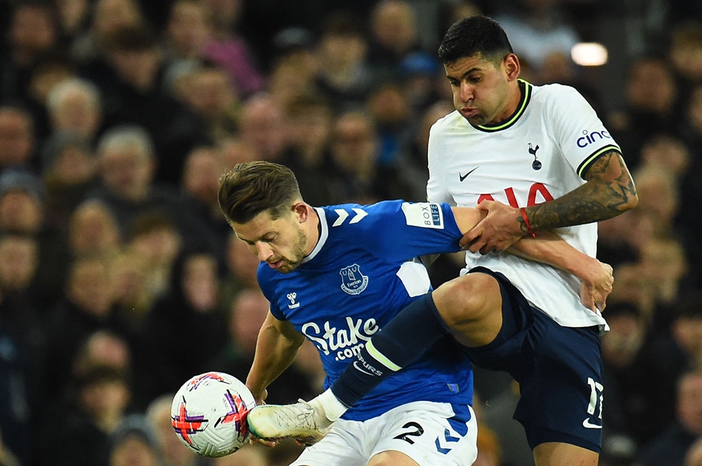LIVERPOOL: Everton’s English defender James Tarkowski (left) fights for the ball with Tottenham Hotspur’s Argentinean defender Cristian Romero during the English Premier League football match on April 3, 2023. – AFP