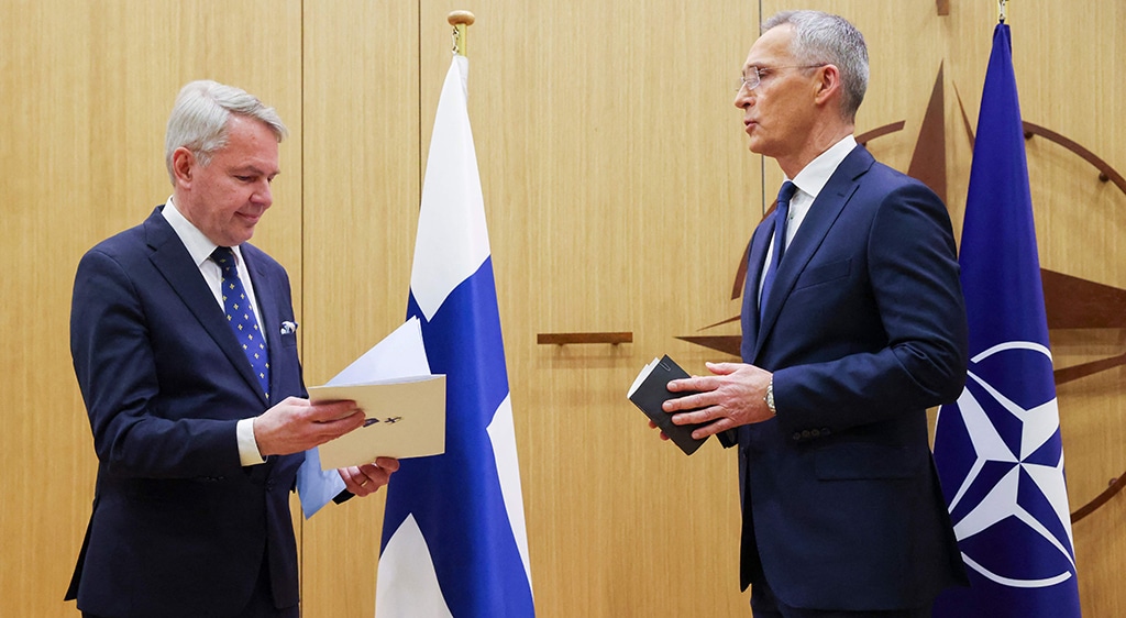 BRUSSELS: NATO Secretary-General Jens Stoltenberg (right) hands over Finland's accession to NATO documents to Finnish Foreign Affairs Minister Pekka Haavisto at the NATO headquarters on April 4, 2023. – AFP