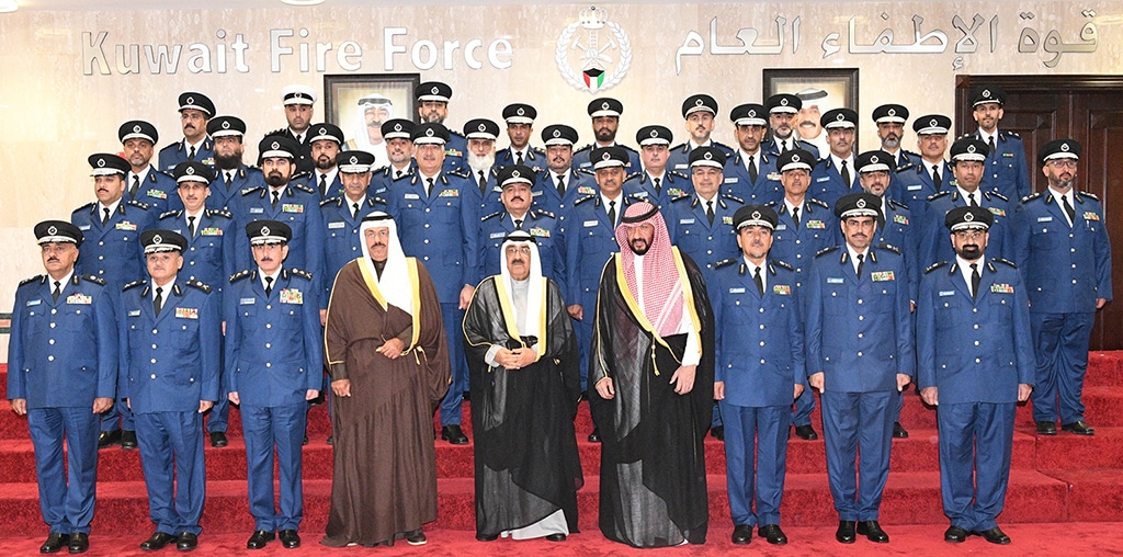 HH the Crown Prince Sheikh Mishal Al-Ahmad Al-Jaber Al-Sabah (center) flanked by HH the Prime Minister Sheikh Ahmad Nawaf Al-Ahmad Al-Sabah and First Deputy Prime Minister, Interior Minister and Acting Defense Minister Sheikh Talal Khaled Al-Ahmad Al-Sabah and other officials at the Kuwait Fire Force during a meeting held at the KFF headquarters on April 3, 2023.