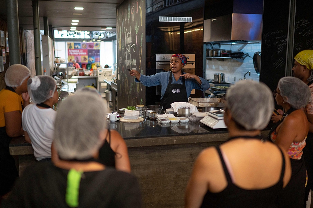 Chocolatier Patricia Nicolau speaks during a class with students at the headquarters of the NGO Gastromotiva in Rio de Janeiro.