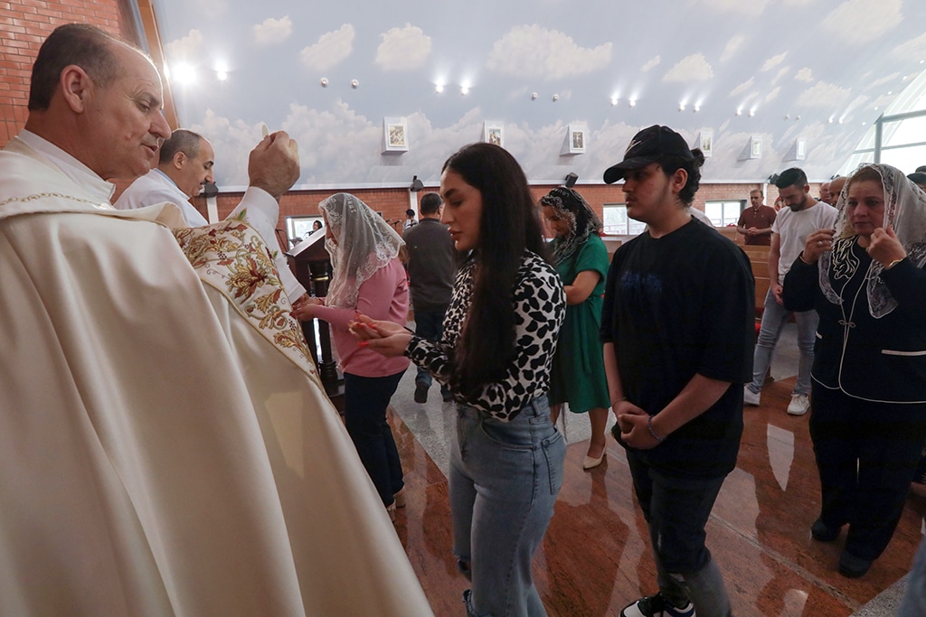 ARBIL: Chaldean Catholic Iraqis attend the Easter mass at Mar Toma (Saint Thomas) Church, in Arbil, the capital of the autonomous Kurdish region of northern Iraq, on April 9, 2023. – AFP