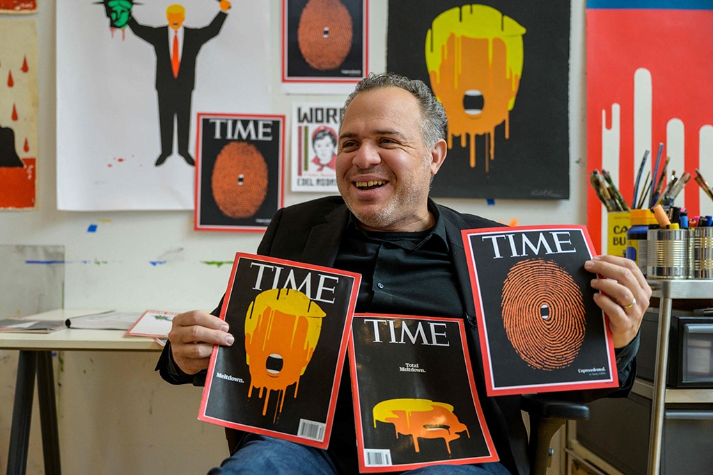 Cuban American artist and illustrator Edel Rodriguez his covers of Time at his studio.— AFP photos