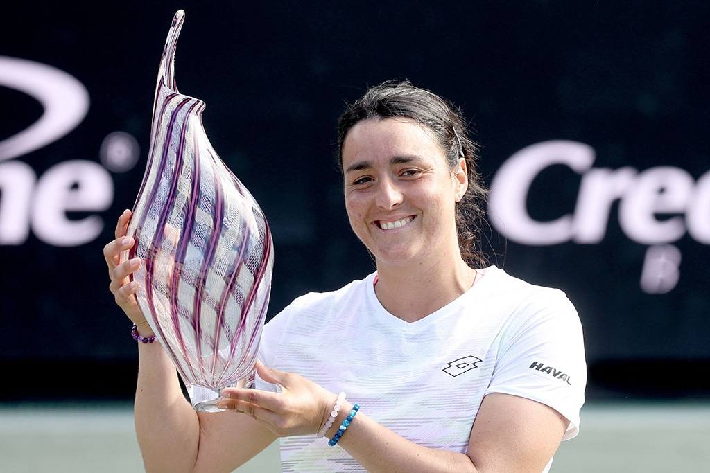 CHARLESTON: Ons Jabeur of Tunisia poses with the trophy after defeating Belinda Bencic of Switzerland during the Finals of the Credit One Charleston Open at Credit One Stadium on April 09, 2023.- AFP
