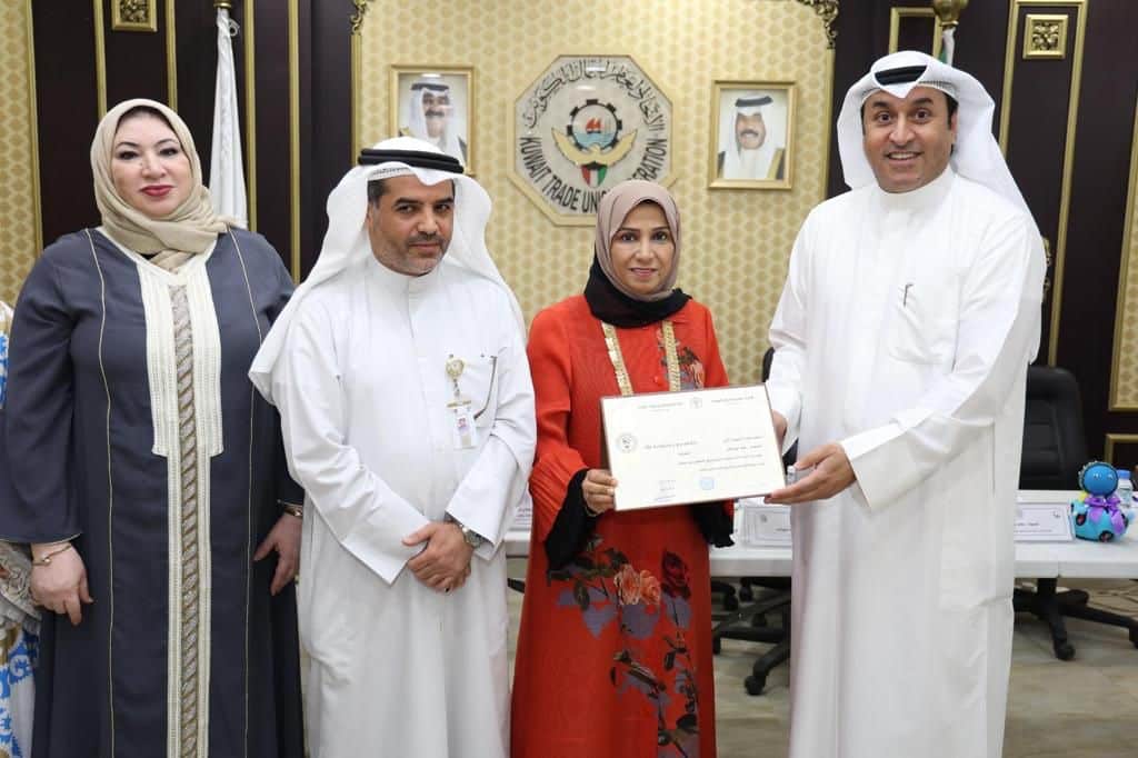 KUWAIT: Rehab Boresli (second right) receives a certificate on the occasion of beginning her term at the United Nations Committee on the Rights of Persons with Disabilities