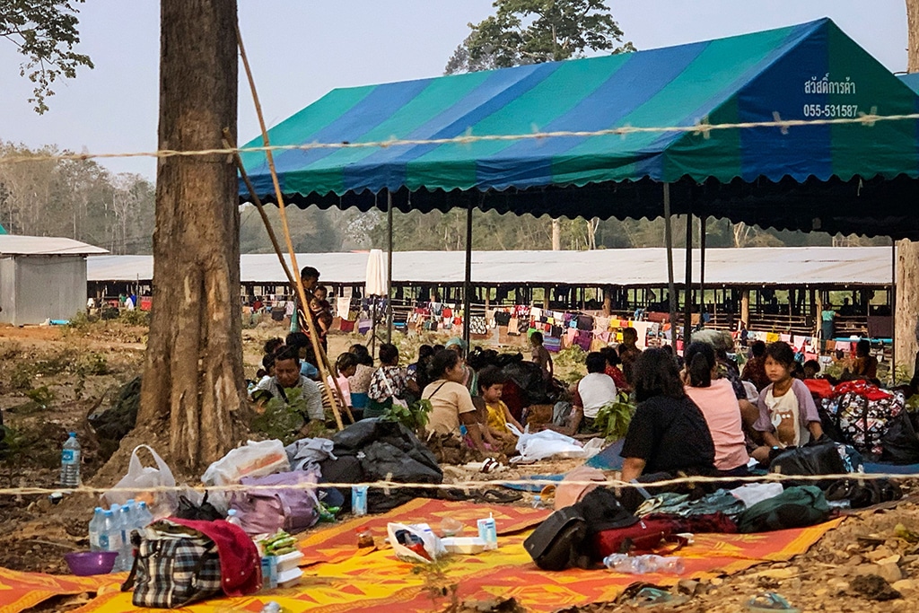 MAE SOT: People fleeing fighting between the Myanmar military and ethnic rebel groups shelter on the Thai side of the Moei river, in Mae Sot district in Tak province. Thousands of people have fled into Thailand following fierce fighting between Myanmar rebels and the military, Thai officials said. – AFP