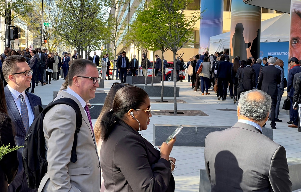 WASHINGTON: People line up outside the IMF and World Bank Spring Meeting registration office in Washington, DC on April 10, 2023. - AFP