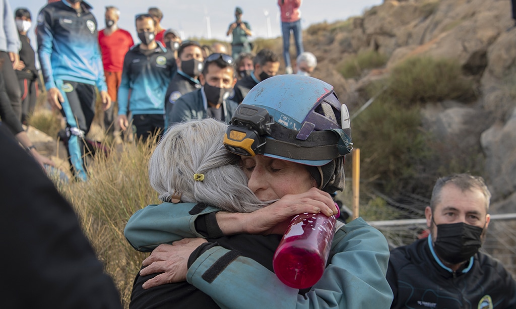 Spanish sportswoman Beatriz Flamini (Right) hugs a relative upon getting out of the cave.