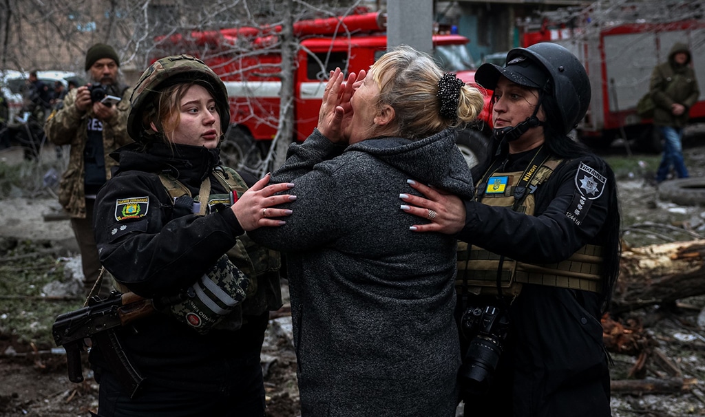 SLOVIANSK: A woman reacts in front of a partially destroyed residential building, after a shelling in Sloviansk, on April 14, 2023, amid Russia's military invasion on Ukraine. – AFP