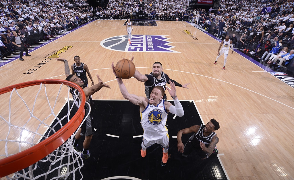 SACRAMENTO: Donte DiVincenzo of the Golden State Warriors goes up for the rebound against during Round One Game One of the 2023 NBA Playoffs against Sacramento Kings on April 15, 2023 at Golden 1 Center. – AFP