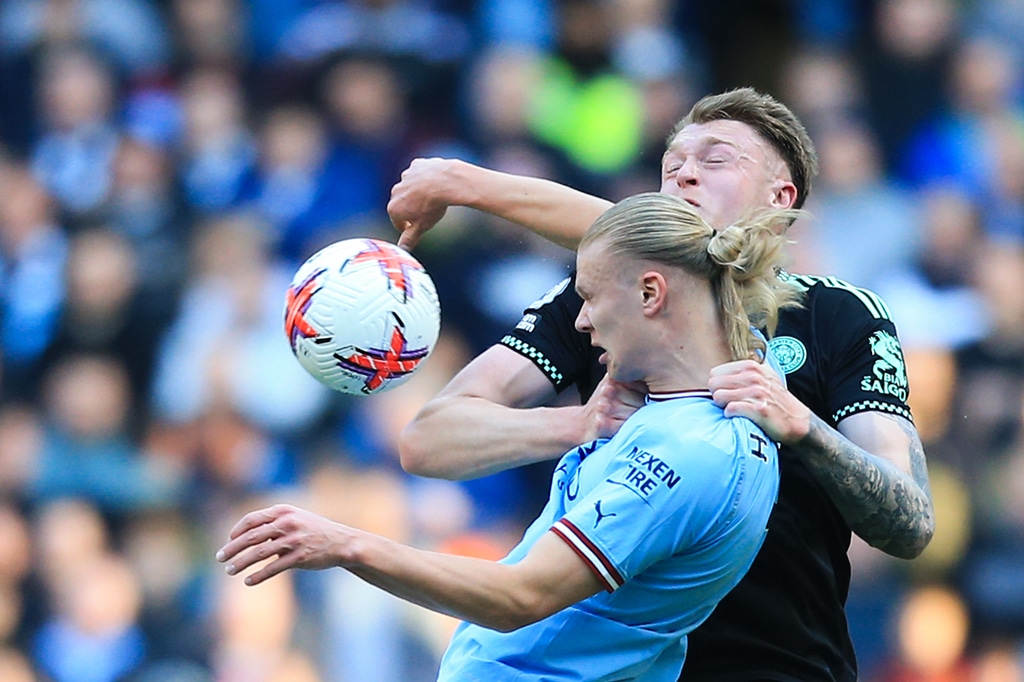 MANCHESTER: Manchester City's Norwegian striker Erling Haaland fights for the ball with Leicester City's Australian defender Harry Souttar at the Etihad Stadium on April 15, 2023. – AFP