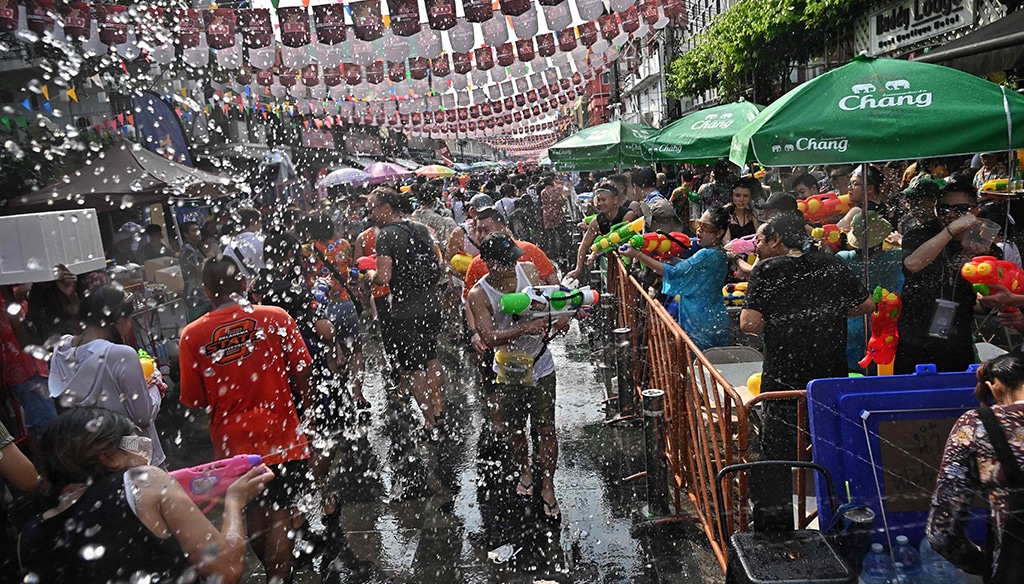 People take part in mass water fights during the first day of Songkran, or Thai New Year, on Khao San Road in Bangkok.—AFP photos.