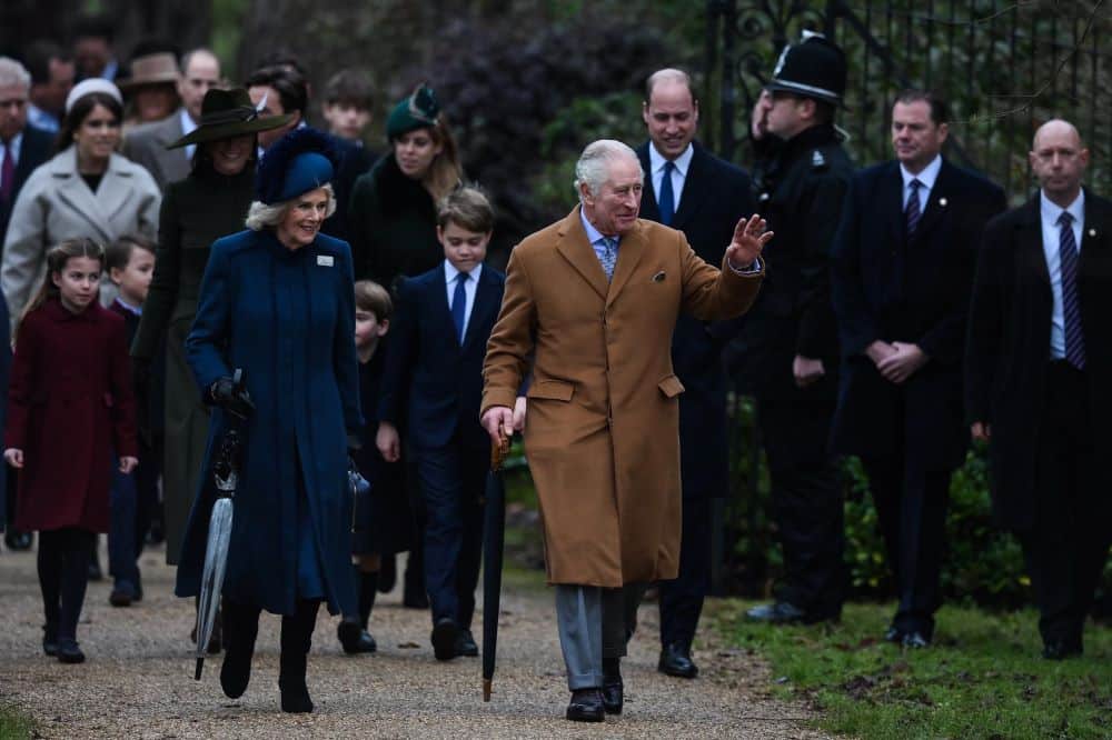Sandringham: In this file photo taken on December 25, 2022 Britain's King Charles III (R) flanked by Britain's Camilla, Queen Consort (L) waves to members of the public as he arrives for the Royal Family's traditional Christmas Day service at St Mary Magdalene Church in Sandringham, Norfolk, eastern England. - AFP