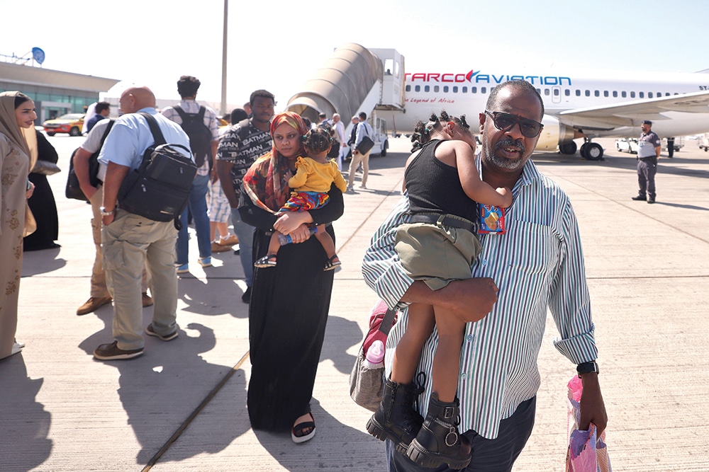 ABU DHABI: People fleeing conflict in Sudan are welcomed by Emirati officials at an airport in Abu Dhabi after an evacuation flight, on April 29, 2023. – AFP