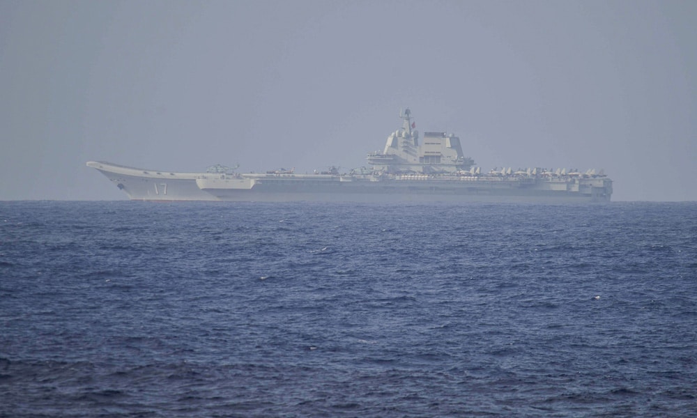 This handout photo taken on April 5, 2023 and released on April 6, 2023 by Japan's Ministry of Defense shows the Chinese aircraft carrier Shandong in Pacific Ocean waters, some 300 kms (186 miles) south of Okinawa prefecture. 
