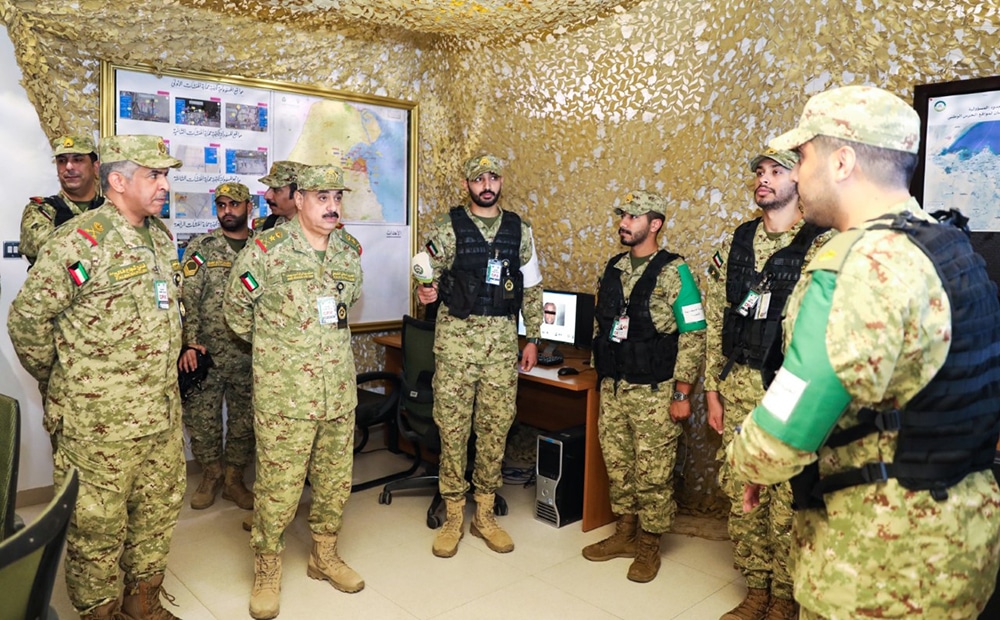 Kuwait National Guard personnel meet with Undersecretary of the National Guard Lieutenant General Engineer Hashim Al-Rifai (second left).