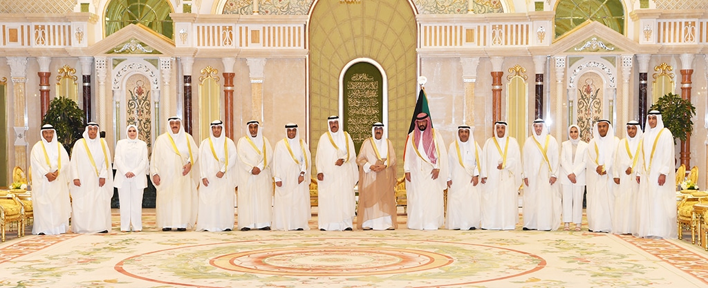 KUWAIT: His Highness the Crown Prince Sheikh Mishal Al-Ahmad Al-Jaber Al-Sabah with His Highness the Prime Minister Sheikh Ahmad Nawaf Al-Ahmad Al-Sabah and the ministers pose for a group photo during the oathntaking ceremony. — KUNA