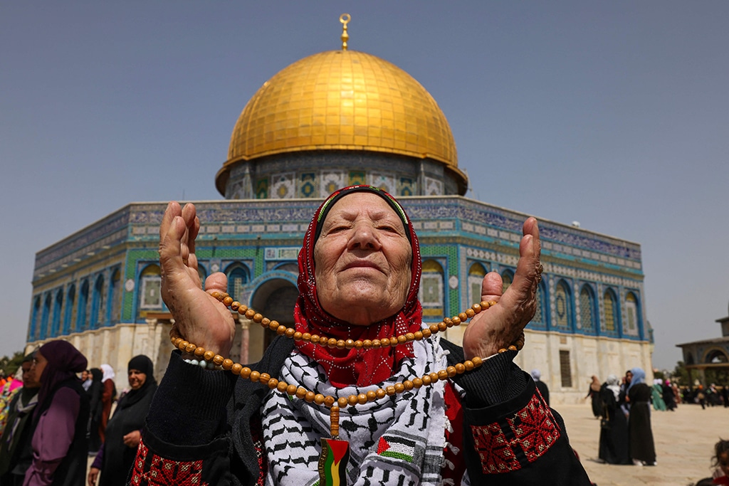 JERUSALEM: A Palestinian devotee reacts as she arrives at the Al-Aqsa Mosque compound for the third Friday noon prayer during the Islamic holy month of Ramadan on April 7, 2023. — AFP