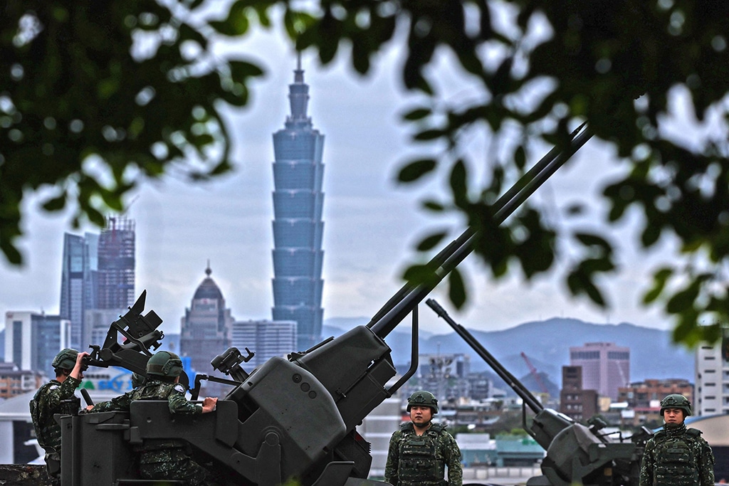 TAIPEI: This handout photo from Taiwan’s Ministry of National Defense shows Taiwanese soldiers manning anti-aircraft artillery near Taipei, as China conducts military exercises around the self-ruled island. — AFP