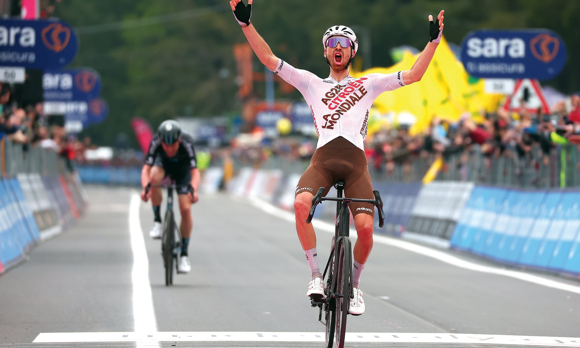 CASSANO IRPINO: AG2R Citroen Team’s French rider Aurelien Paret-Peintre celebrates as he crosses the finish line to win the fourth stage of the Giro d’Italia 2023 cycling race, 175 km between Venosa and Lago Laceno, on May 9, 2023. - AFP