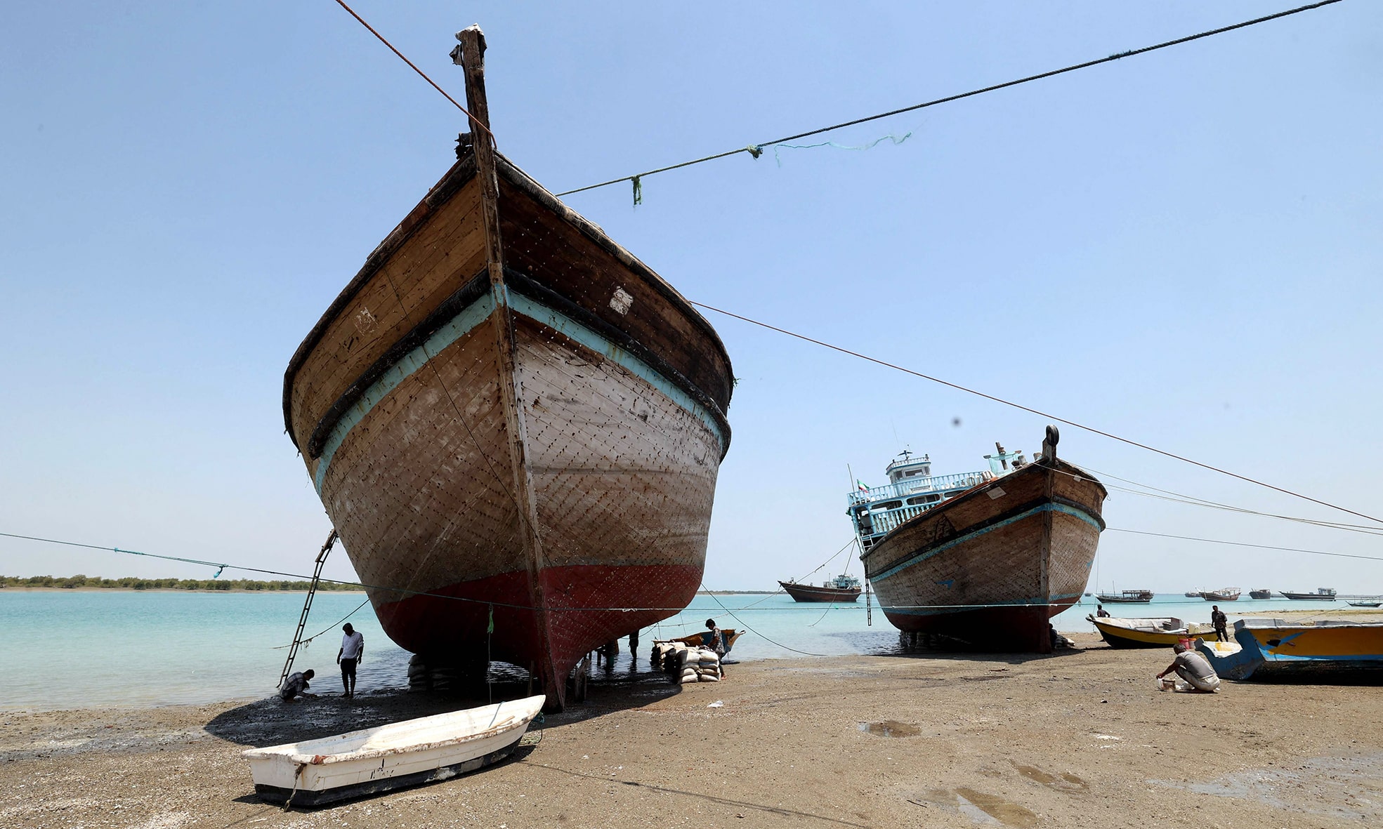 Traditional wooden ships (lenj) are pictured on Iran's touristic Qeshm island in the Gulf.—AFP photos
