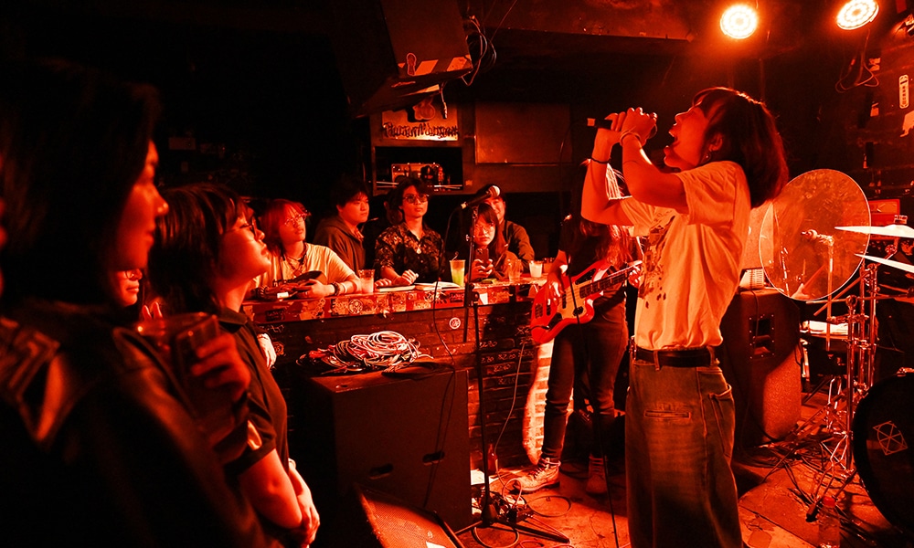 This photo shows lead singer Yuetu of punk band Xiaowang performing at a club in Beijing. --AFP photos