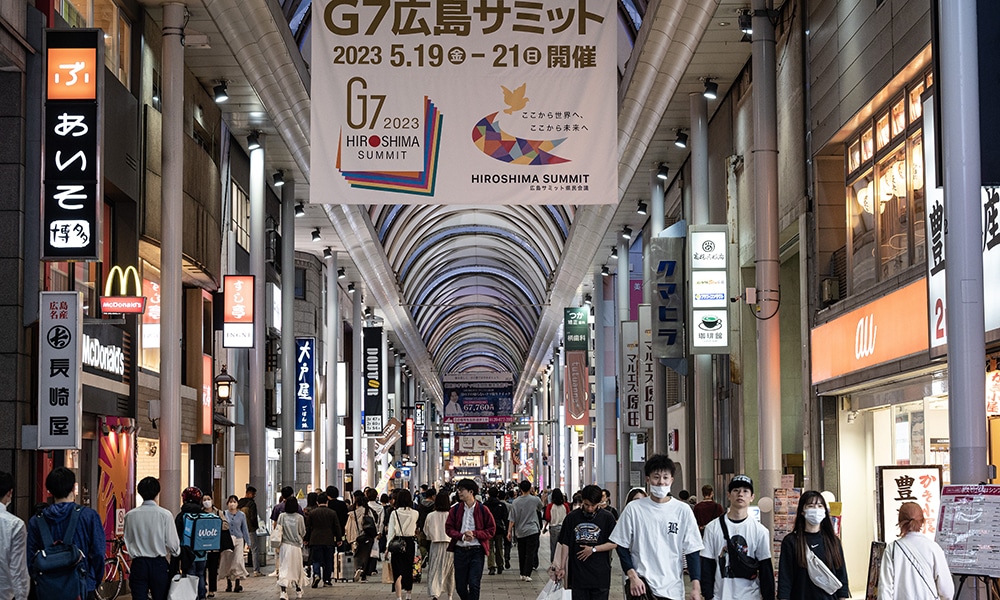 HIROSHIMA: A large banner hangs from the roof of a popular shopping precinct advertising the G7 Leaders’ Summit in Hiroshima on May 14, 2023 just days ahead of the arrival of leaders for the event. – AFP
