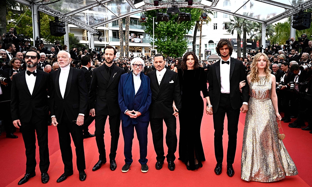 (From left) French actor Melvil Poupaud, French actor Pascal Greggory, French actor Benjamin Lavernhe, French actor Pierre Richard, US actor Johnny Depp, French actress and director Maiwenn, her son actor Diego Le Fur and German actress Pauline Pollmann pose as they arrive for the opening ceremony and the screening of the film 'Jeanne du Barry'.
