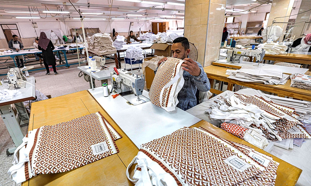 Bags are fabricated from cloths at the Malaika Linens factory.