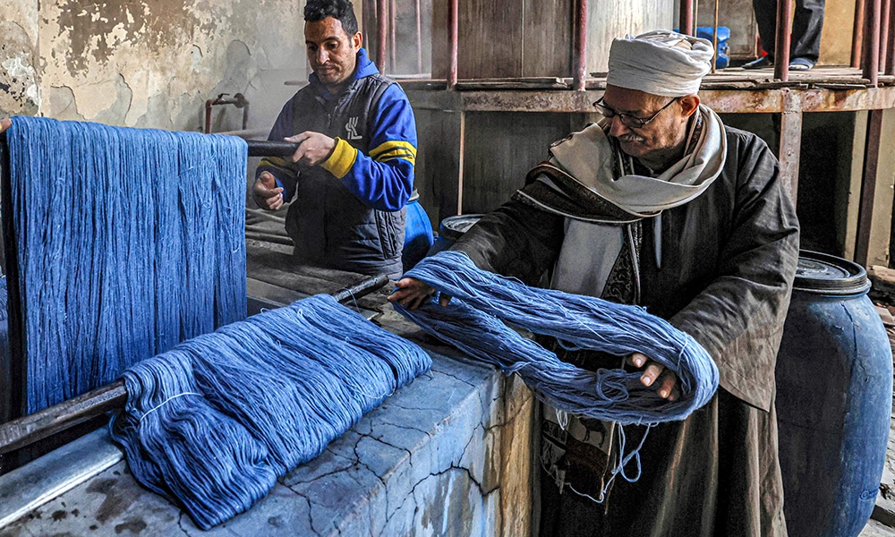 Threads are dyed at the Kahhal looms hand-made rugs workshop in the Basatin district of Cairo.