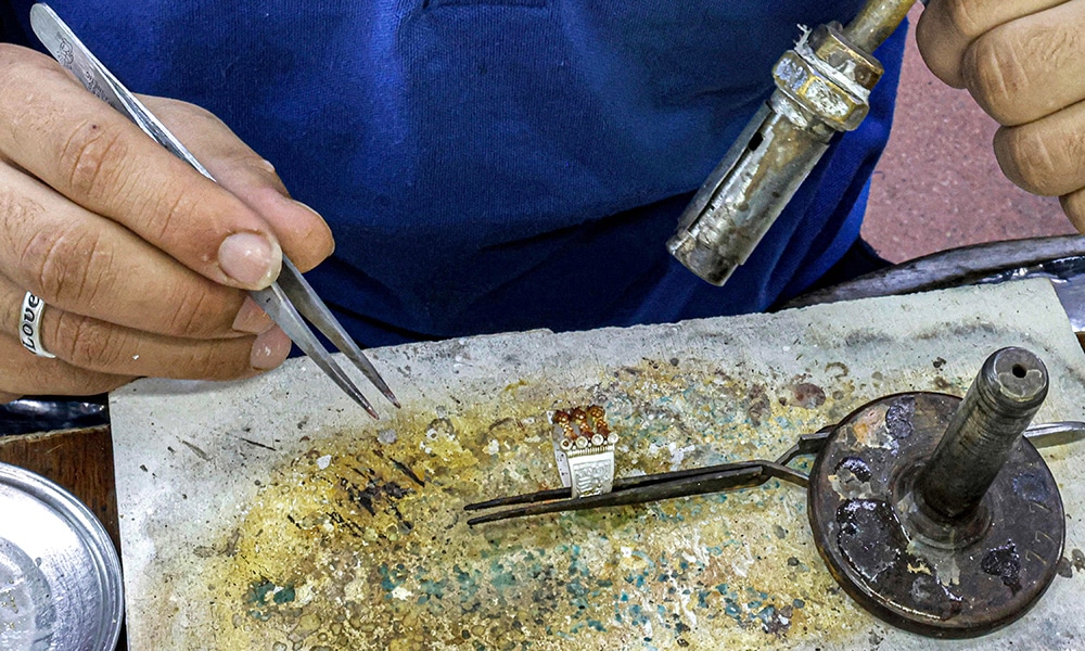 A smith fabricates jewellery at the Azza Fahmy workshop.