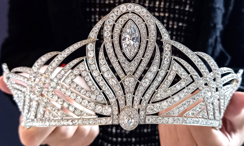 This photograph shows an employee of Christie's auction house holding the Bessborough Diamond Tiara.—AFP
