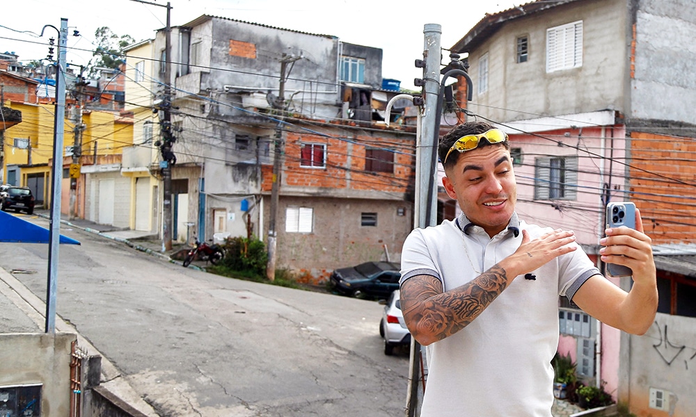 SAO PAULO: Influencer Murilo Duarte streams a live video at the Jardim Joao XXIII slum in Sao Paulo, Brazil, on April 19, 2023. – AFP