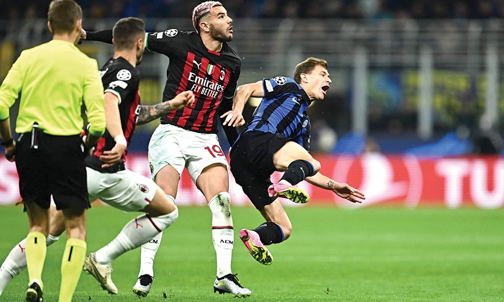 MILAN: AC Milan’s French defender Theo Hernandez (center) fouls Inter Milan’s Italian midfielder Nicolo Barella during the UEFA Champions League semi-final second leg football match between Inter Milan and AC Milan on May 16, 2023.- AFP