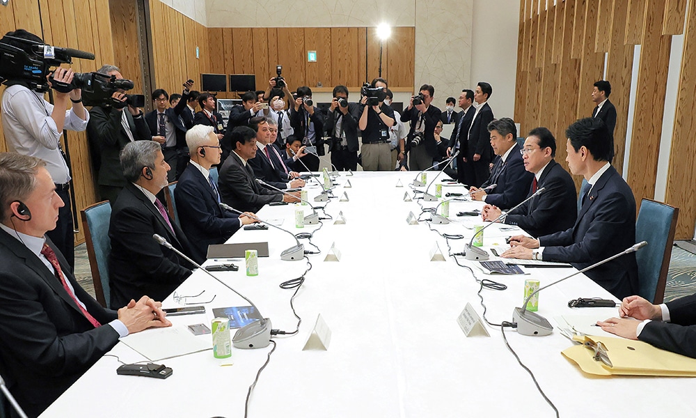 TOKYO: Japan's Prime Minister Fumio Kishida (third right) exchanges opinions with executives of a major overseas semiconductor manufacturer at the prime minister's official residence in Tokyo on May 18, 2023. -- AFP