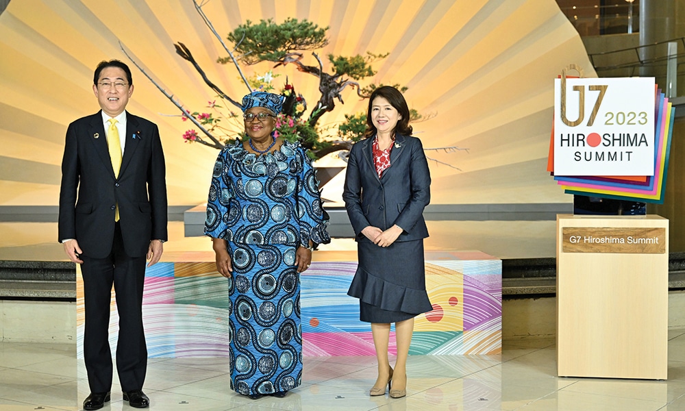 HIROSHIMA: Japan's Prime Minister Fumio Kishida (left) and his wife Yuko Kishida (right) pose with WTO director-general Ngozi Okonjo-Iweala (center) at the official welcoming for the 'Outreach' leaders and their partners on the second day of the G7 Summit Leaders' Meeting in Hiroshima on May 20, 2023. – AFP