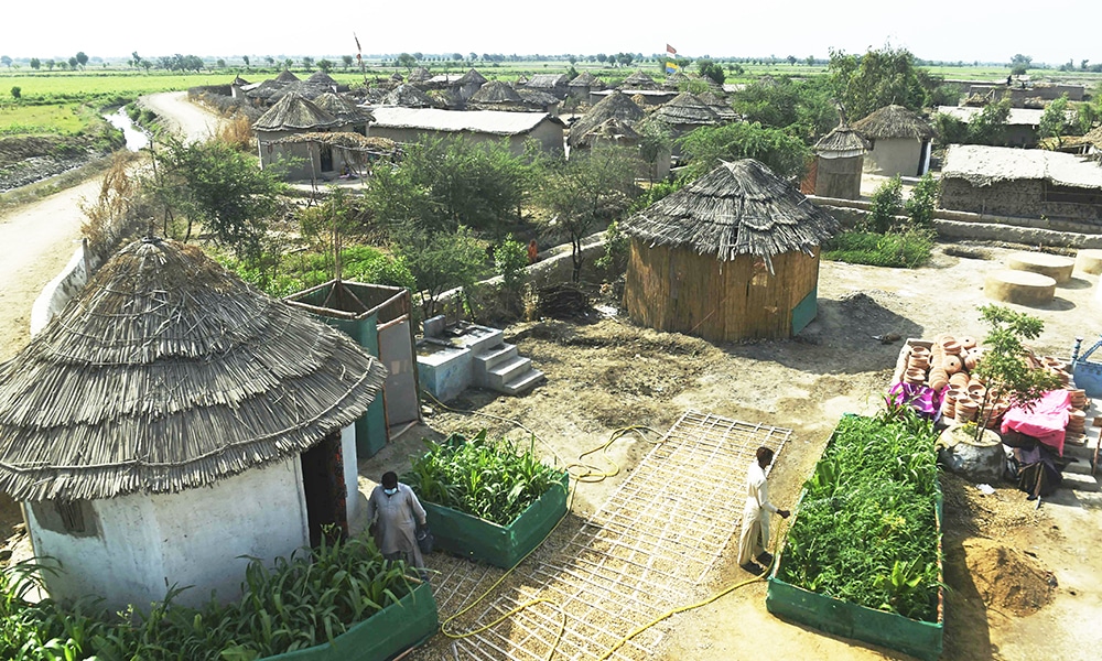 This picture taken on April 9, 2023, shows a general view of Pono Colony in Sanjar Chang village, in Tando Allahyar district. At 82 years old, architect Yasmeen Lari is forging the way in fortifying Pakistan's rural communities, who are living on the frontline of climate change. The few pilot settlements already constructed are credited with saving families from the worst of the catastrophic monsoon flooding that put a third of the country underwater last year. (Photo by Asif HASSAN / AFP)