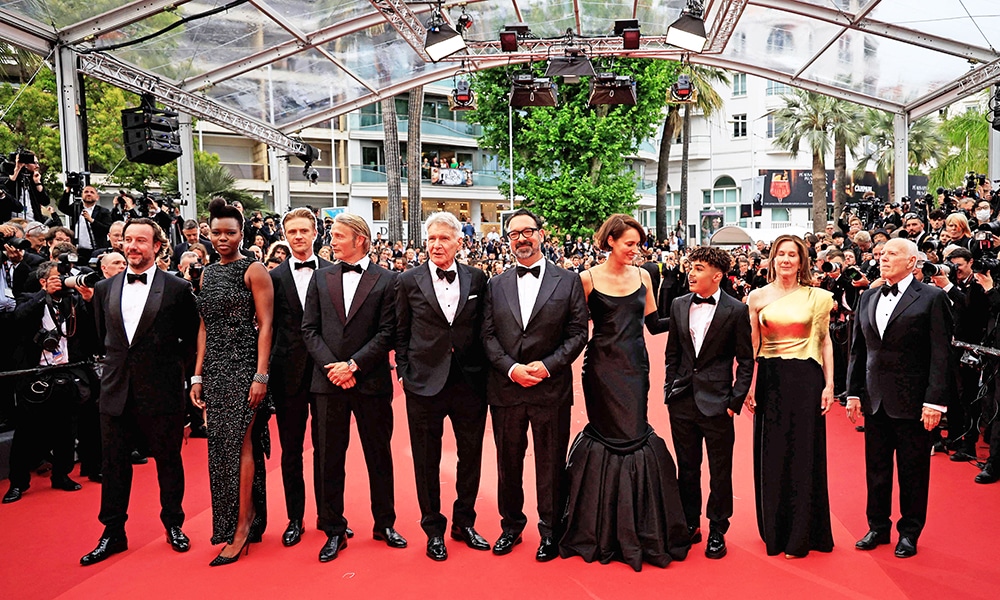 (From left) British producer Simon Emanuel, US actress Shaunette Renee Wilson, US actor Boyd Holbrook, Danish actor Mads Mikkelsen, US actor Harrison Ford, US director James Mangold, British actor Ethann Isidore, US producer Kathleen Kennedy and US producer Frank Marshall arrive for the screening of the film 'Indiana Jones and the Dial of Destiny' during the 76th edition of the Cannes Film Festival in Cannes, southern France.—AFP photos