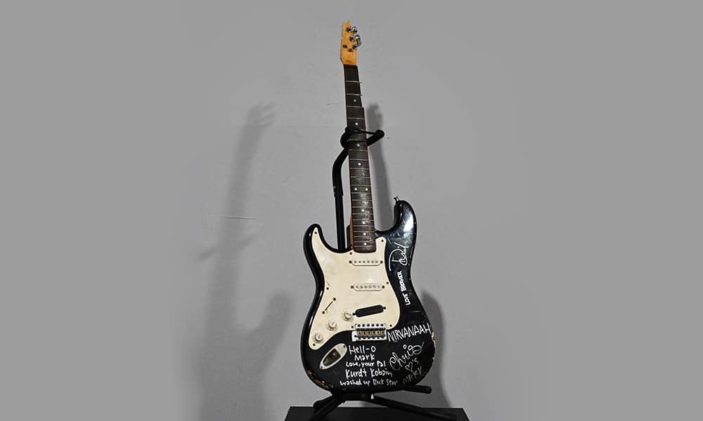 File photos show US musician Kurt Cobain's smashed Fender Stratocaster is dispalyed at Julien's Auctions in Gardena, California on May 2, 2023, ahead of Julien's 'Music Icons' auction of over 1,200 items from Rock And Roll history and exclusive artist collections.—AFP photos