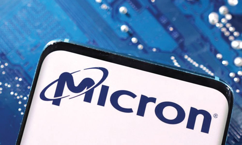 FILE PHOTO: A smartphone with a displayed Micron logo is placed on a computer motherboard in this illustration taken March 6, 2023. REUTERS/Dado Ruvic/Illustration